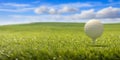 Golfball on tee ready to be shot on green lawn grass, blue sky background. 3d illustartion