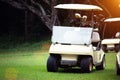 Golfcar in beautiful golf course in the evening golf course with sunshine Royalty Free Stock Photo