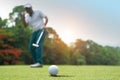 Golfer action to win after long putting golf ball on the green golf Royalty Free Stock Photo