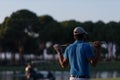 Golfer from back at course looking to hole in distance Royalty Free Stock Photo