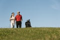 Golfer and Caddie playing golf.