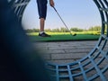 Golfer child on practice mat during golf lesson Royalty Free Stock Photo