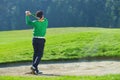 Golfer chipping the ball from sand trap Royalty Free Stock Photo