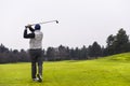 Close up Golfer is driving golf ball to green course Royalty Free Stock Photo