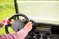 Golfer driving his golf buggy forward Royalty Free Stock Photo