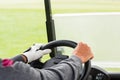 Golfer driving his golf buggy forward Royalty Free Stock Photo