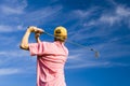 Golfer finishing his swing