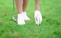 Golfer fixes golf ball and holds golf club in his hand. Royalty Free Stock Photo