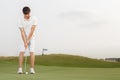 Golfer getting ready to hit the ball Royalty Free Stock Photo