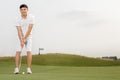 Golfer getting ready to hit the ball Royalty Free Stock Photo