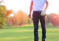 The golfer hit the color ball and walked on the playing court. With confidence Royalty Free Stock Photo