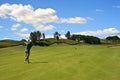 Golfer hitting the ball