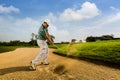 Golfer hitting the ball on the sand. Speeds Cause blurred Royalty Free Stock Photo