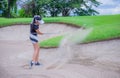 Golfer hitting the ball on the sand. Speeds Cause blurred by movement Royalty Free Stock Photo