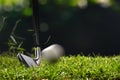 Golfer hitting golf ball with club Royalty Free Stock Photo