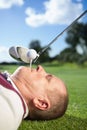 Golfer holding tee in his teeth Royalty Free Stock Photo