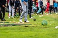 Golfer legs at golf tournament practice swing with golf club Royalty Free Stock Photo