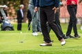 Golfer legs at golf tournament practice swing with golf club Royalty Free Stock Photo