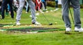 Golfer legs at golf tournament practice swing with driver Royalty Free Stock Photo