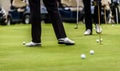 Golfer legs at golf tournament practice swing with golf club Royalty Free Stock Photo