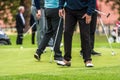 Golfer legs at golf tournament practice swing with golf club Royalty Free Stock Photo