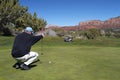 Golfer Lining His Putt Royalty Free Stock Photo