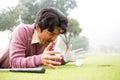 Golfer lying near golf ball