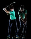 Golfer man golfing golf swing isolated black background multiple exposure Royalty Free Stock Photo