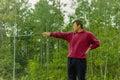 Golfer Nick Faldo points golf club