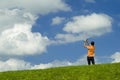 Golfer in orange shirt