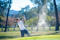 Golfer playing a chip shot onto the green Royalty Free Stock Photo
