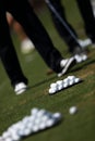 Golfer playing golf on a golf course Royalty Free Stock Photo