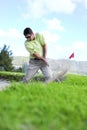 Golfer playing out of a sand trap Royalty Free Stock Photo