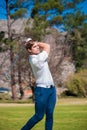 Golfer playing a shot on the fairway Royalty Free Stock Photo