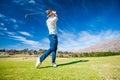 Golfer playing a shot on the fairway Royalty Free Stock Photo