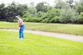 Golfer practicing and concentrating before and after shot Royalty Free Stock Photo