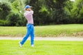 Golfer practicing and concentrating before and after shot Royalty Free Stock Photo