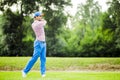 Golfer practicing and concentrating before and after shot Royalty Free Stock Photo