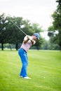 Golfer practicing and concentrating before and after shot Royalty Free Stock Photo