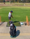 Golfer practicing at golf driving range practice facilit