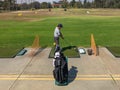 Golfer practicing at golf driving range practice facilit