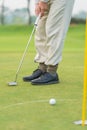 Golfer preparing for a putt Golf ball on the green during golfcourse