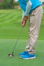 Golfer preparing for a putt Golf ball on the green during golfcourse Royalty Free Stock Photo