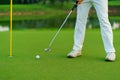 Golfer preparing for a putt Golf ball on the green during golfcourse Royalty Free Stock Photo