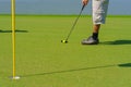 Golfer preparing for a putt Golf ball on the green during golfcourse