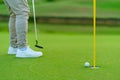 Golfer preparing for a putt Golf ball on the green during golfcourse Royalty Free Stock Photo
