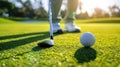 Golfer preparing to swing at a golf ball on the fairway. Royalty Free Stock Photo