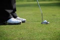 Golfer putting Royalty Free Stock Photo