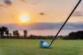 Golfer is putting golf ball on green grass at golf course for training to hole  with blur background a Royalty Free Stock Photo
