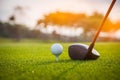 Golfer is putting golf ball on green grass at golf course for training to hole  with blur background a Royalty Free Stock Photo